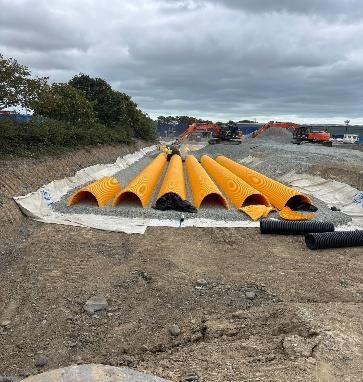 Large diameter attenuation pipes installed as part of a sustainable drainage system